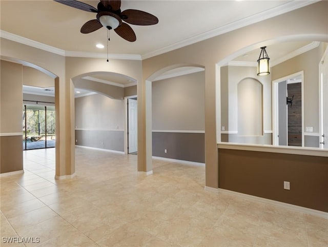 unfurnished room with ceiling fan and crown molding