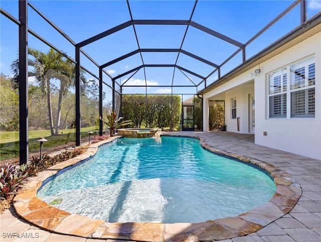 view of swimming pool with an in ground hot tub, a lanai, and a patio area