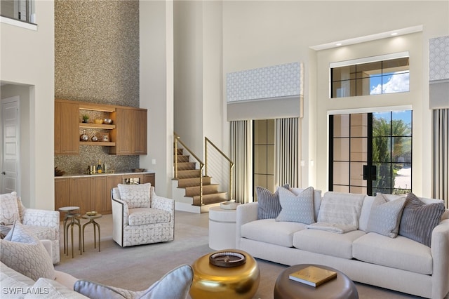 living room featuring a high ceiling