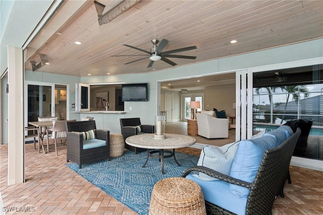 view of patio / terrace with ceiling fan and an outdoor hangout area