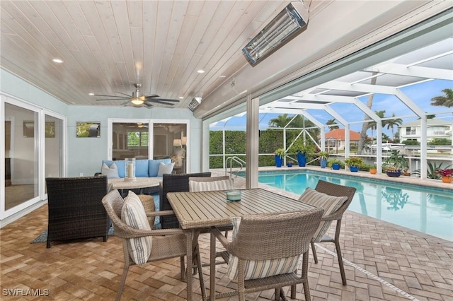 sunroom / solarium featuring wooden ceiling and ceiling fan