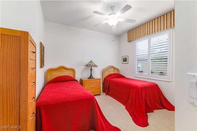 bedroom featuring ceiling fan and carpet floors