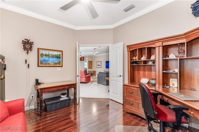 office space featuring ceiling fan, dark hardwood / wood-style floors, and ornamental molding