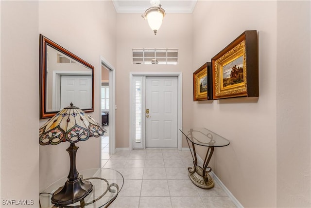 entryway featuring crown molding and light tile patterned flooring