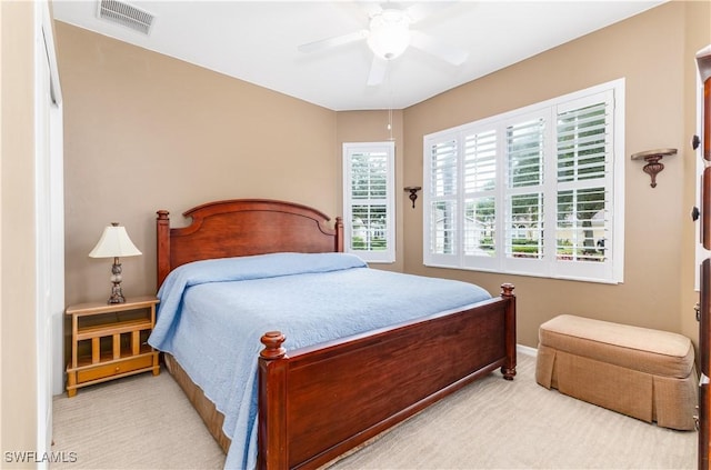 bedroom with ceiling fan and carpet floors