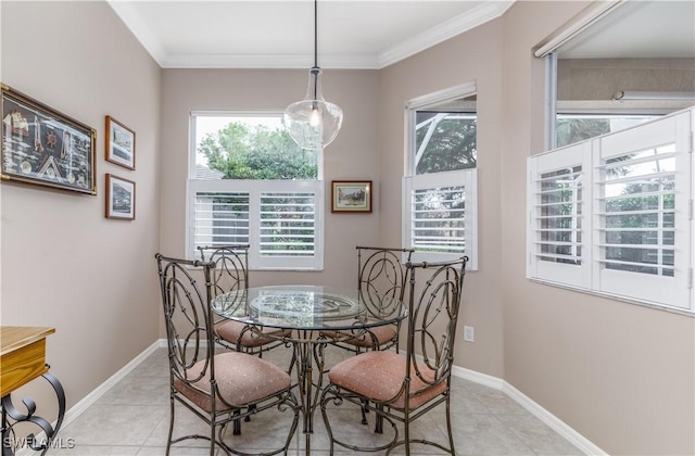 tiled dining room featuring crown molding