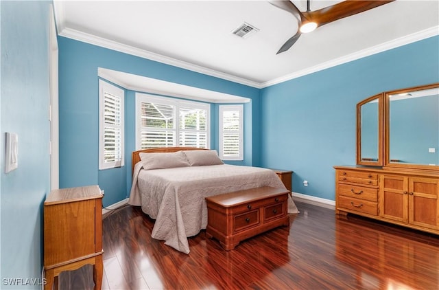 bedroom featuring dark hardwood / wood-style floors, ceiling fan, and ornamental molding