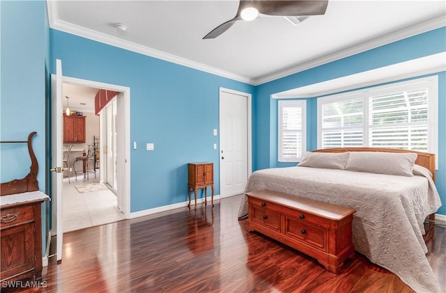 bedroom featuring ceiling fan, hardwood / wood-style floors, and ornamental molding