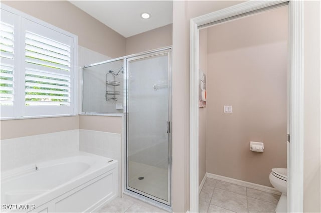 bathroom with tile patterned floors, toilet, and independent shower and bath