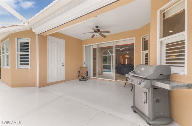 view of patio / terrace with ceiling fan and area for grilling