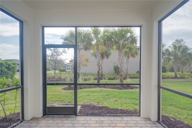 unfurnished sunroom featuring a wealth of natural light