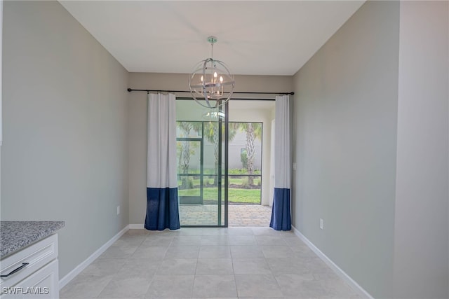 unfurnished dining area with a notable chandelier and light tile patterned floors