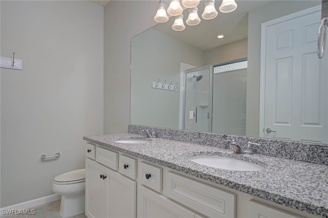 bathroom featuring tile patterned floors, vanity, toilet, and an enclosed shower