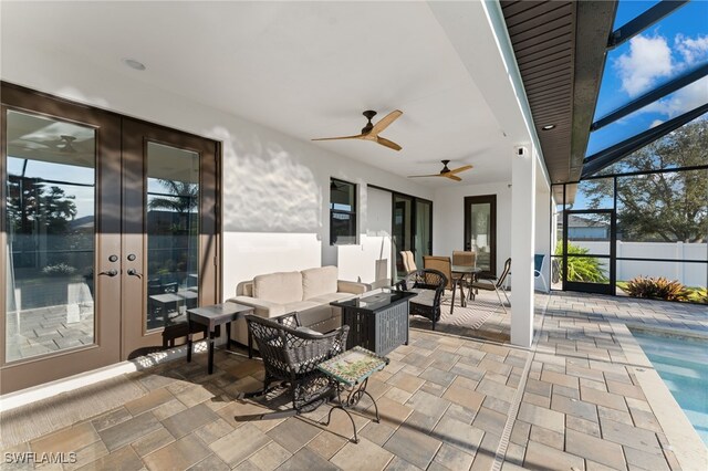 view of patio / terrace featuring glass enclosure, an outdoor hangout area, and french doors