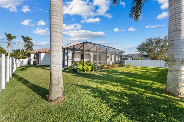 view of yard featuring a lanai