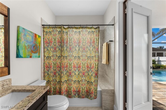 full bathroom featuring vanity, toilet, and shower / tub combo with curtain