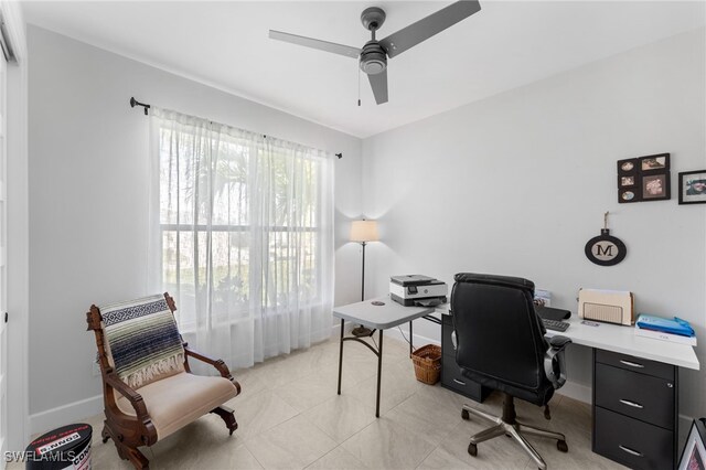 office area featuring ceiling fan and light tile patterned floors