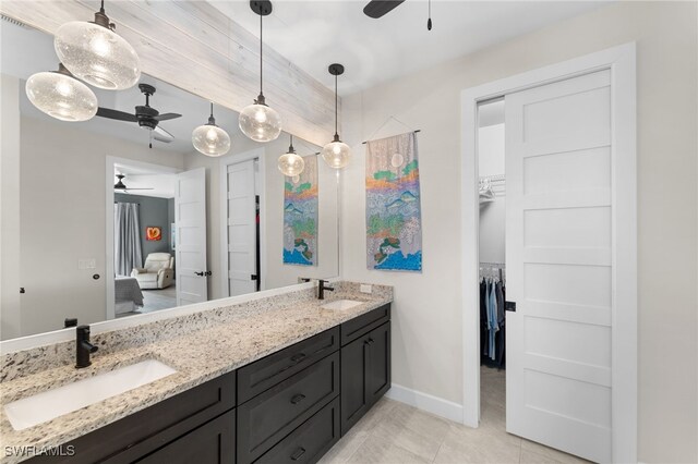 bathroom featuring tile patterned flooring, ceiling fan, and vanity