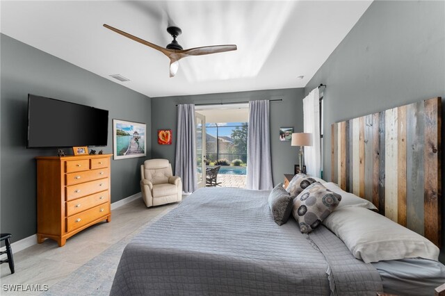 bedroom featuring access to outside, ceiling fan, and light tile patterned floors