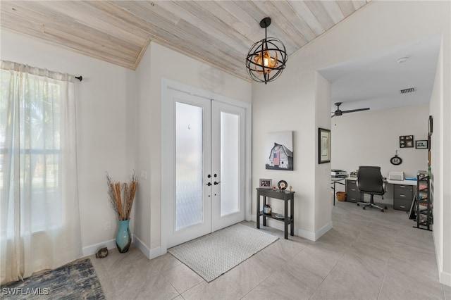 tiled entrance foyer featuring ceiling fan, french doors, wooden ceiling, and vaulted ceiling