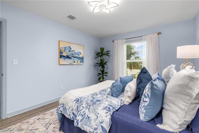 bedroom featuring hardwood / wood-style floors