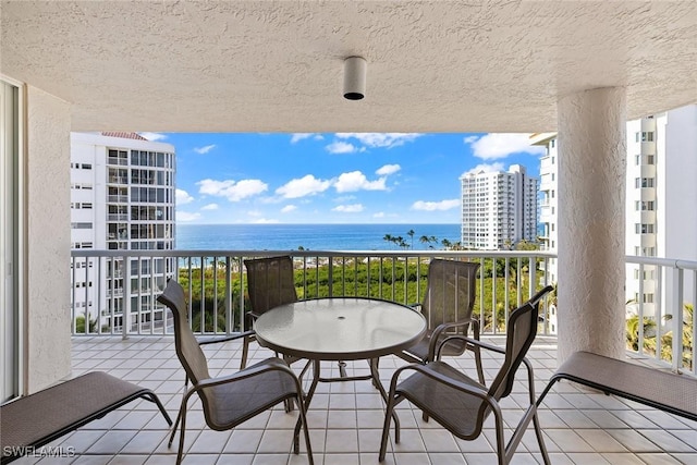 balcony featuring a water view