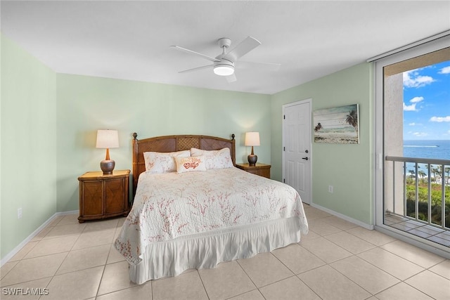 bedroom with access to exterior, ceiling fan, a water view, and light tile patterned flooring