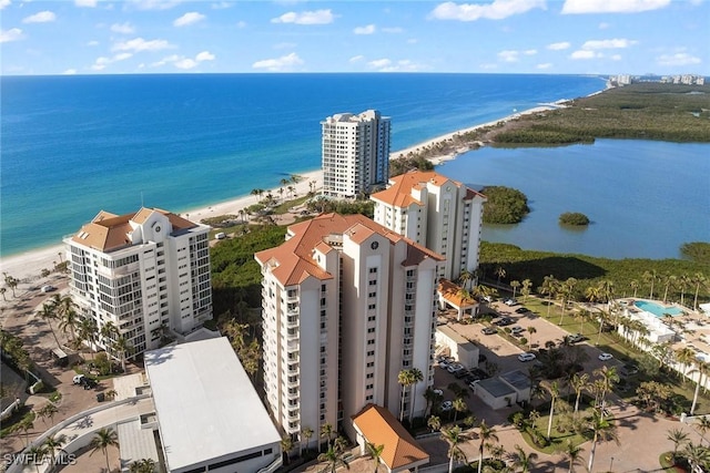 bird's eye view featuring a water view and a view of the beach