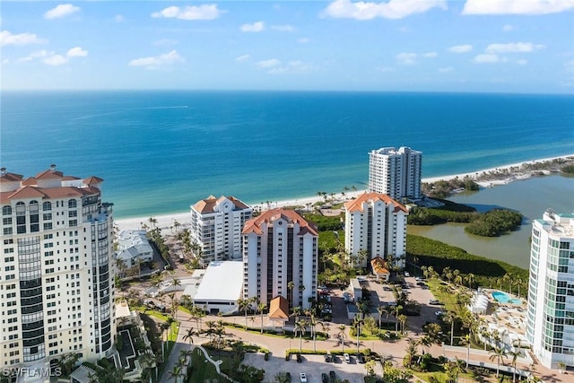 birds eye view of property featuring a water view and a view of the beach