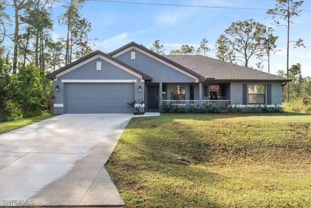 view of front of home with a garage, covered porch, and a front lawn