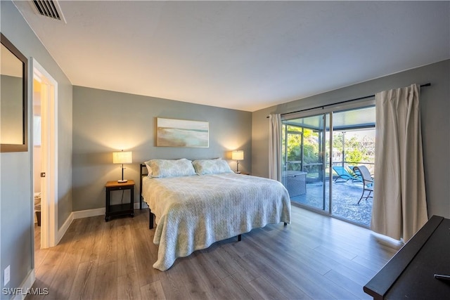 bedroom featuring access to outside and light hardwood / wood-style flooring