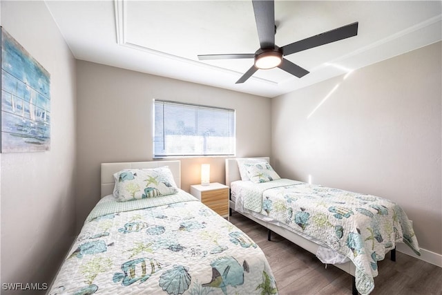 bedroom featuring wood-type flooring and ceiling fan