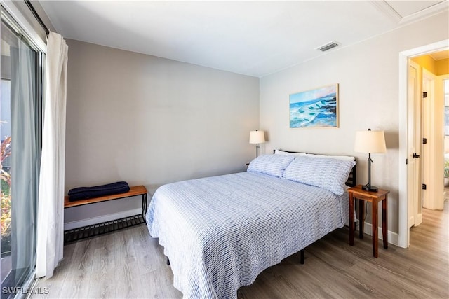 bedroom featuring wood-type flooring