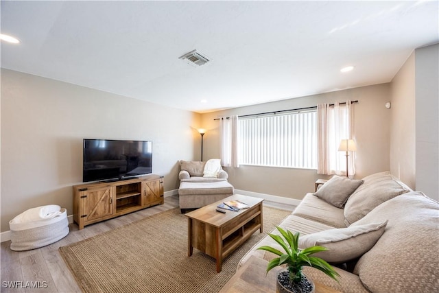 living room with light hardwood / wood-style floors