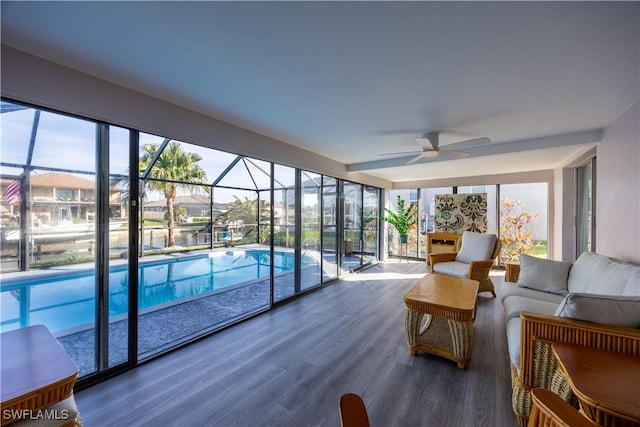 sunroom with a pool and ceiling fan