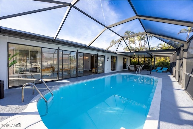 view of pool featuring a lanai and a patio area