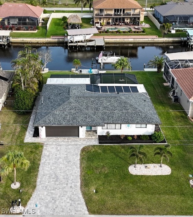 birds eye view of property with a water view