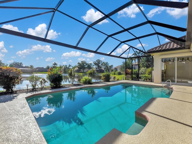 view of swimming pool featuring a water view, a patio area, and a lanai