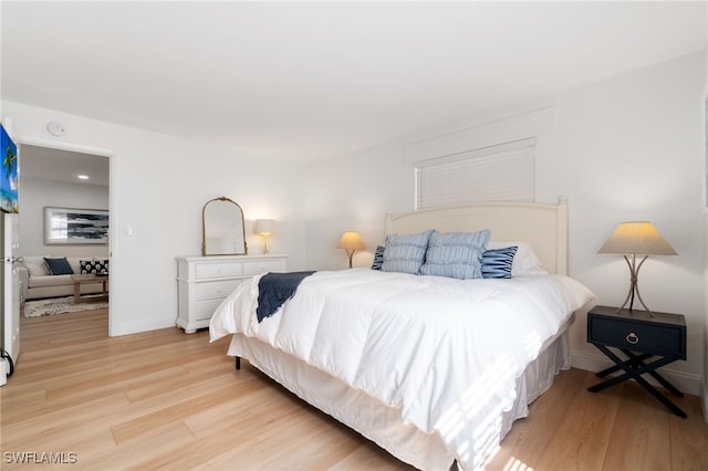 bedroom with light hardwood / wood-style floors