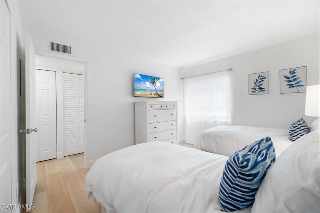 bedroom with light hardwood / wood-style floors