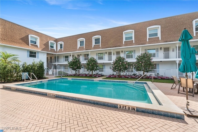 view of pool featuring a patio