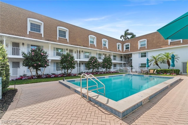 view of swimming pool with a patio