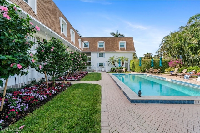 view of swimming pool with a patio