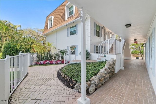 view of property exterior featuring a porch