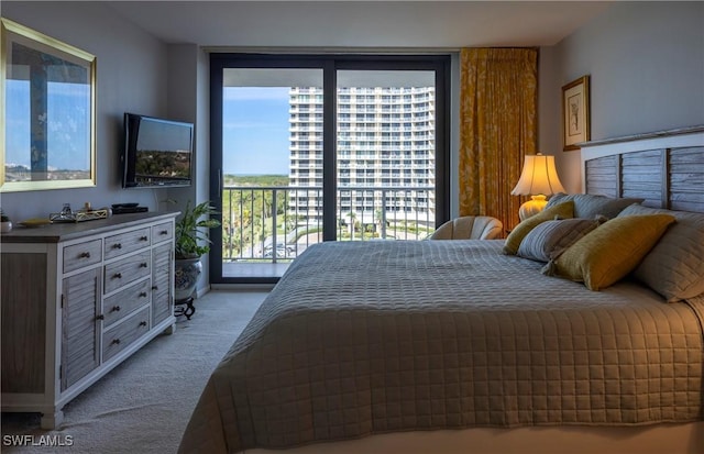 bedroom with access to exterior, floor to ceiling windows, and light colored carpet