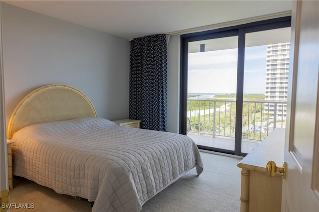 carpeted bedroom with access to outside and floor to ceiling windows