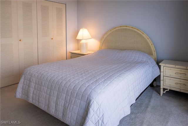 carpeted bedroom featuring a closet