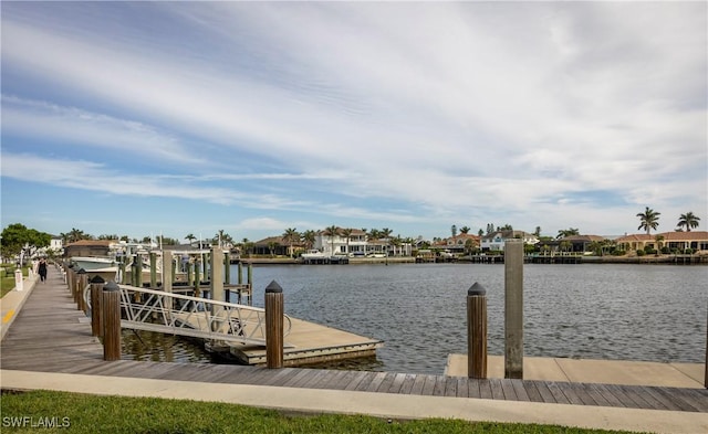 dock area with a water view and boat lift