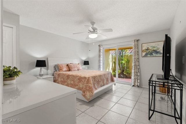 bedroom with access to exterior, light tile patterned floors, a textured ceiling, and ceiling fan