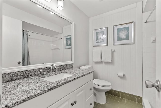 bathroom with curtained shower, toilet, vanity, and tile patterned flooring